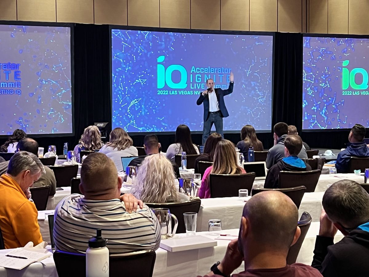 Steve Werner presenting to a conference room of attendees